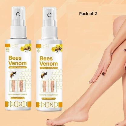 Two bottles of 'Bees Venom' hair removal spray with a person's legs and hand on a beige background.
